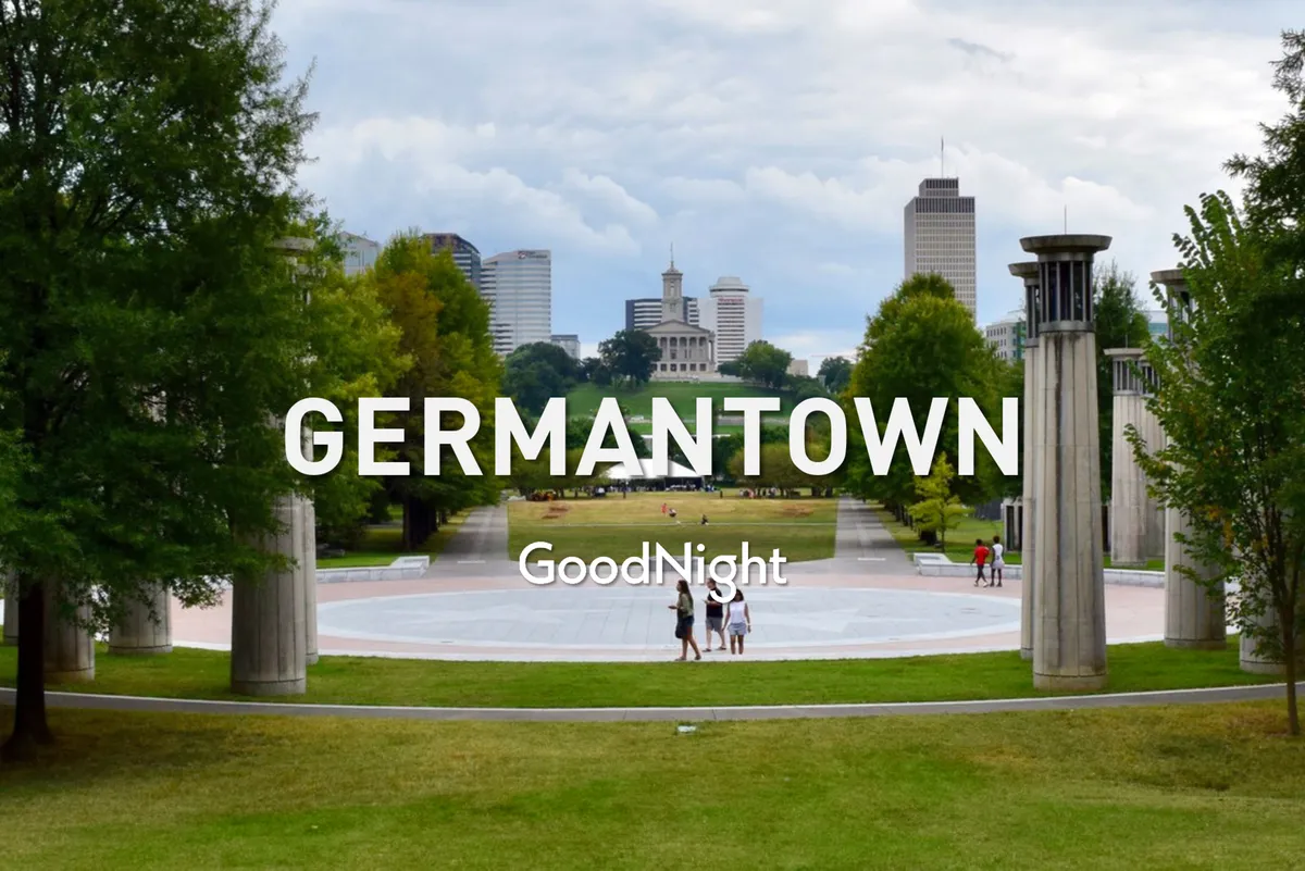 A relaxed and communal park scene with green grass, trees, the city skyline, and people walking or picnicking. The space is open and welcoming, ideal for family gatherings or relaxing after a busy day exploring.