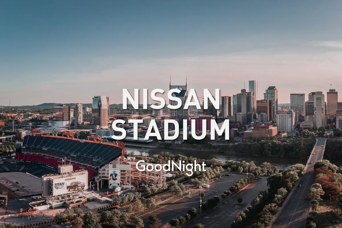 A wide-angle exterior shot featuring Nashville’s city skyline, the Nissan Stadium, and the river, bustling with energy and possibility. The urban context and landmark views set the scene for accessible business hubs and vibrant city life.